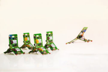 Ant-like Mini-Robots leap over and move objects together